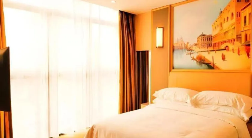 Bed in Vienna Hotel Fujian Fuqing Wanda Plaza