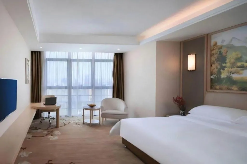 Bed in Vienna Hotel Fujian Fuqing Wanda Plaza