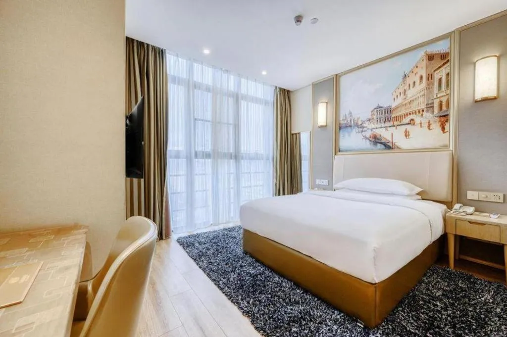 Bed in Vienna Hotel Fujian Fuqing Wanda Plaza
