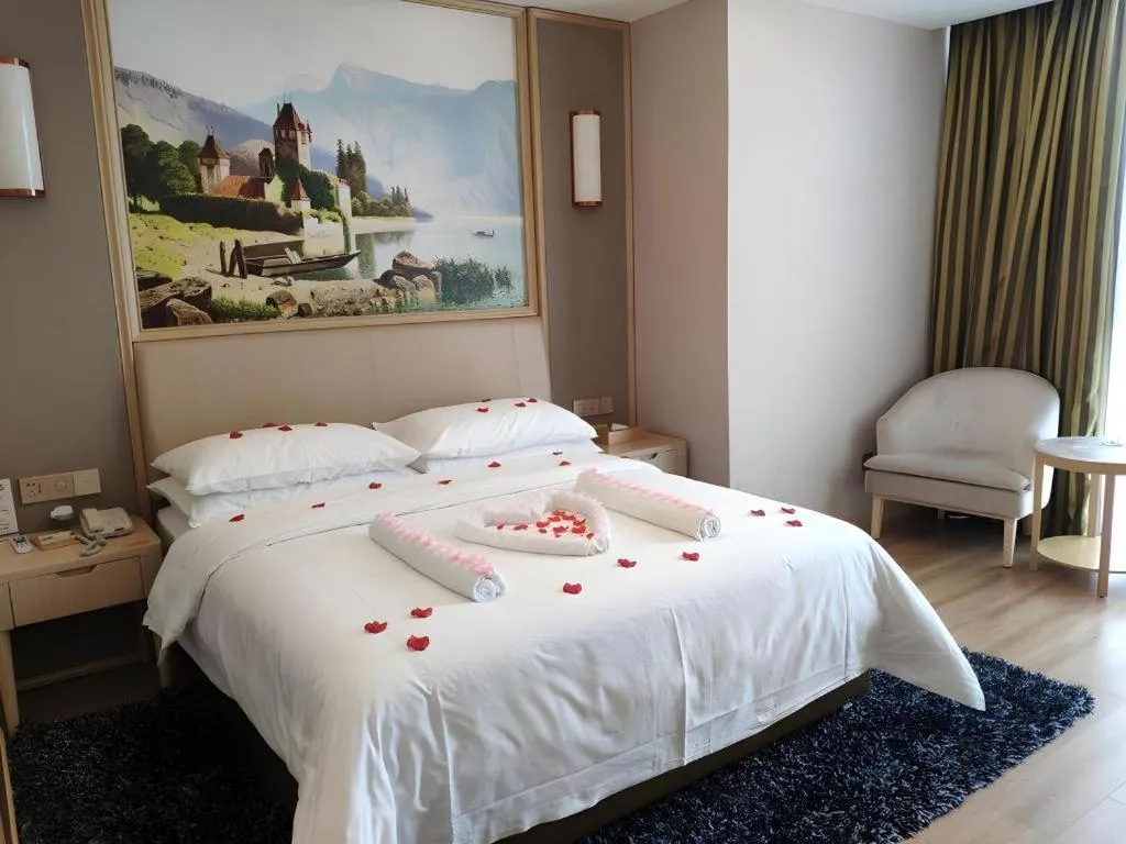 Bed in Vienna Hotel Fujian Fuqing Wanda Plaza