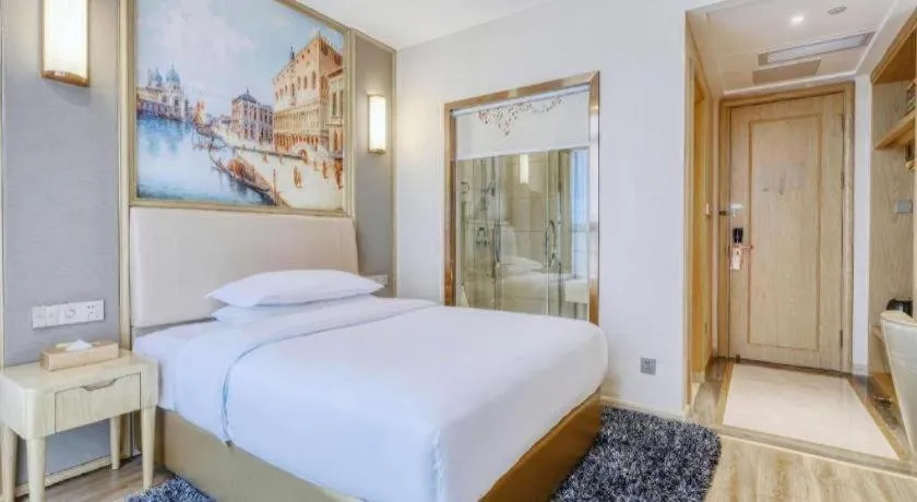 Bed in Vienna Hotel Fujian Fuqing Wanda Plaza