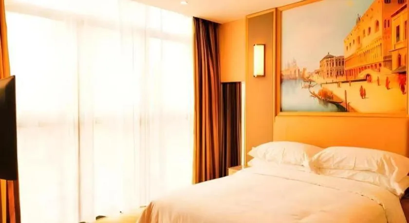 Bed in Vienna Hotel Fujian Fuqing Wanda Plaza