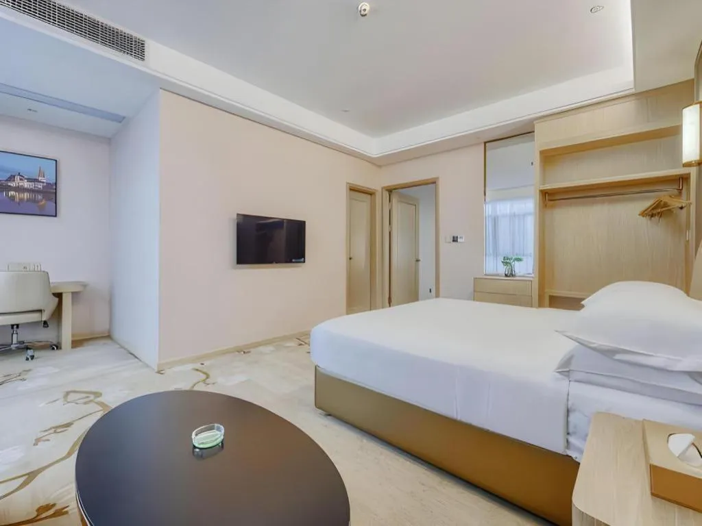 Bed in Vienna Hotel Fujian Fuqing Wanda Plaza