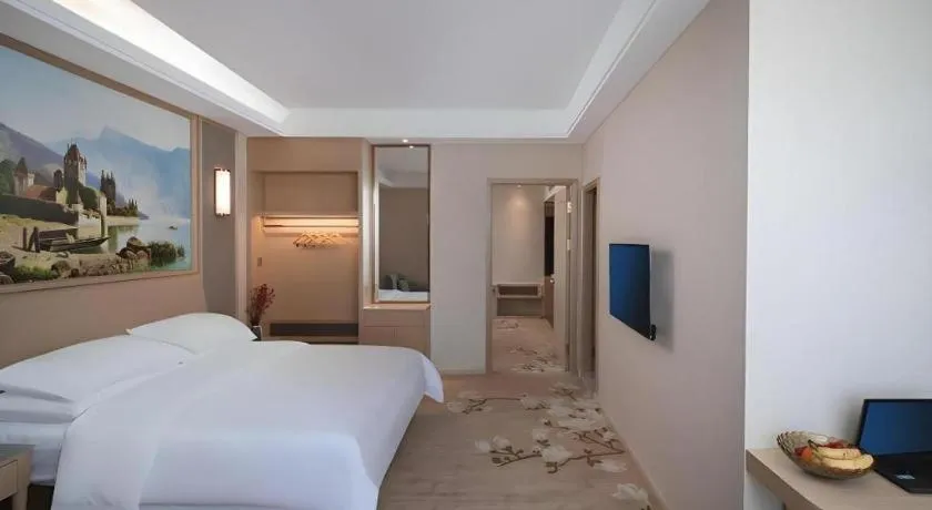 Bed in Vienna Hotel Fujian Fuqing Wanda Plaza