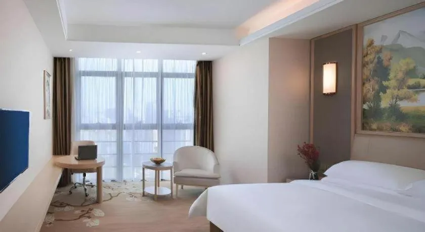 Bed in Vienna Hotel Fujian Fuqing Wanda Plaza