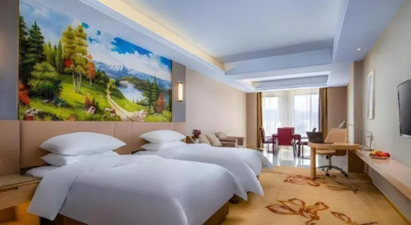 Bed in Vienna Hotel Anhui Fuyang Funan Bailing Apartment