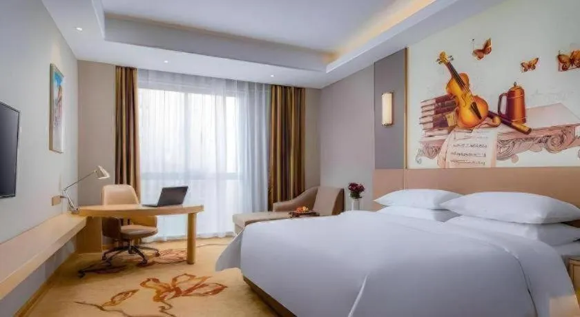 Bed in Vienna Hotel Anhui Fuyang Funan Bailing Apartment