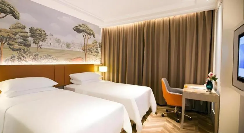 Bed in Vienna Hotel Jinan Beiyuan Street Red Star Macalline