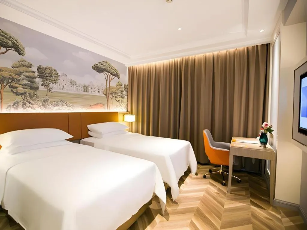 Bed in Vienna Hotel Jinan Beiyuan Street Red Star Macalline