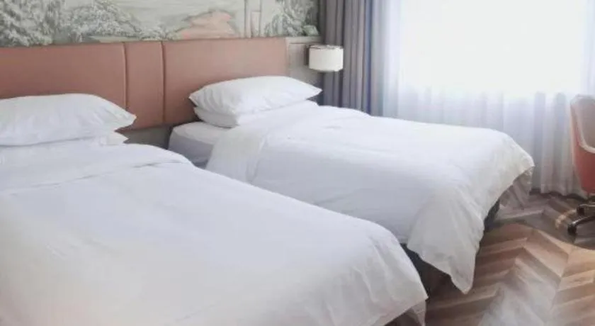 Bed in Vienna Hotel Jinan Beiyuan Street Red Star Macalline