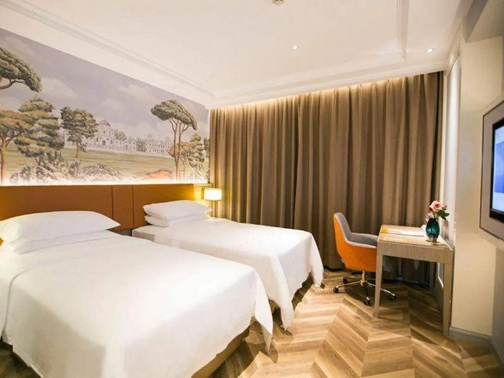 Bed in Vienna Hotel Jinan Beiyuan Street Red Star Macalline