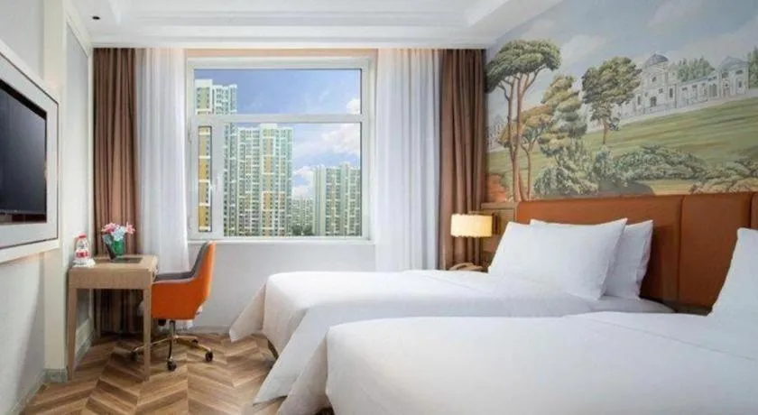 Bed in Vienna Hotel Jinan Beiyuan Street Red Star Macalline