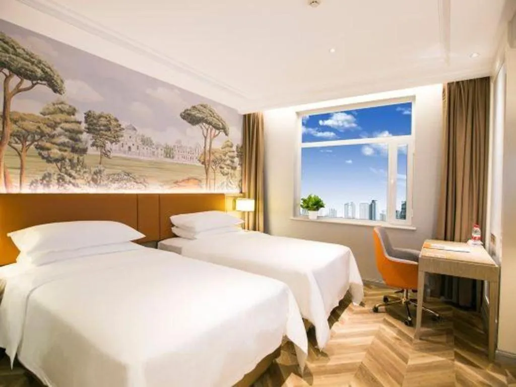 Bed in Vienna Hotel Jinan Beiyuan Street Red Star Macalline
