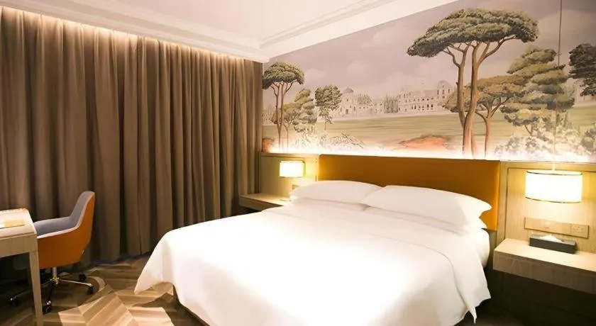 Bed in Vienna Hotel Jinan Beiyuan Street Red Star Macalline
