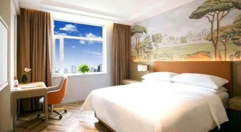 Bed in Vienna Hotel Jinan Beiyuan Street Red Star Macalline