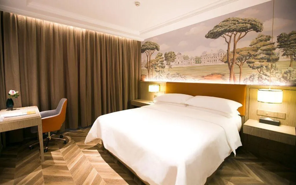 Bed in Vienna Hotel Jinan Beiyuan Street Red Star Macalline