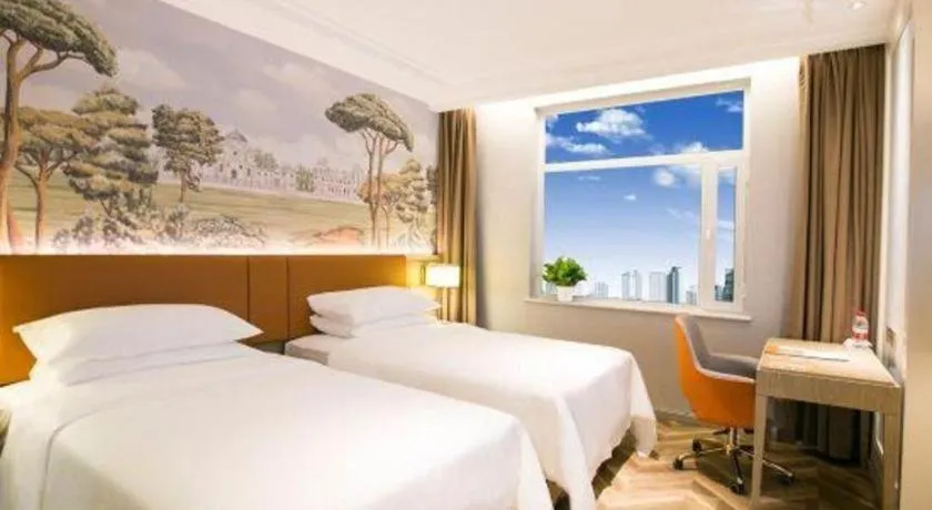 Bed in Vienna Hotel Jinan Beiyuan Street Red Star Macalline