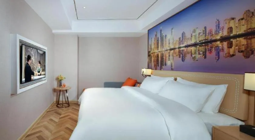 Bed in Vienna Hotel Guangxi Baise Xilin County Juting Cultural Arts Center