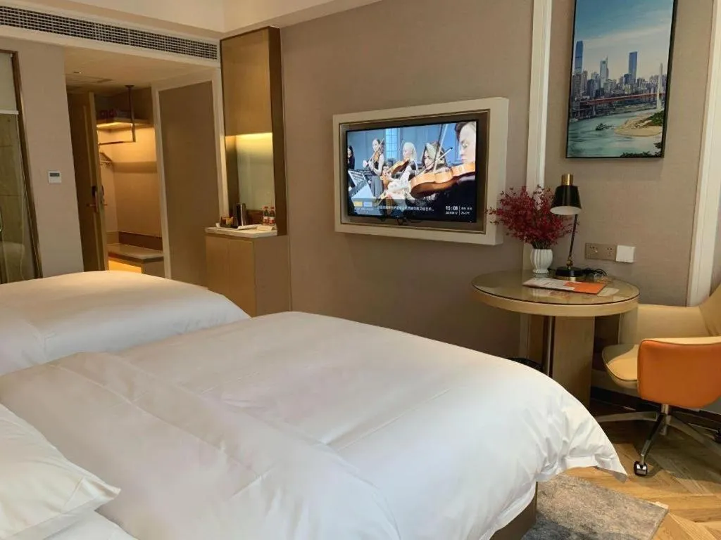 Bed in Vienna Hotel Guangxi Baise Xilin County Juting Cultural Arts Center