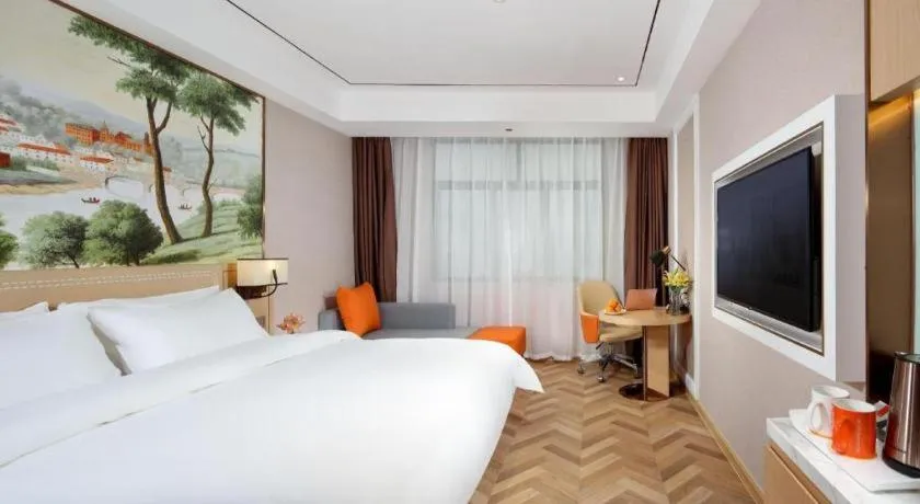 Bed in Vienna Hotel Guangxi Baise Xilin County Juting Cultural Arts Center