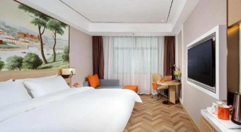 Bed in Vienna Hotel Guangxi Baise Xilin County Juting Cultural Arts Center
