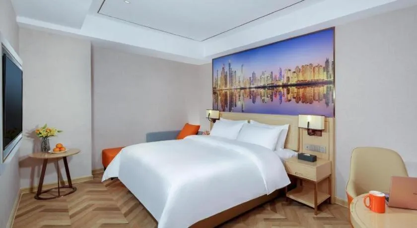 Bed in Vienna Hotel Guangxi Baise Xilin County Juting Cultural Arts Center