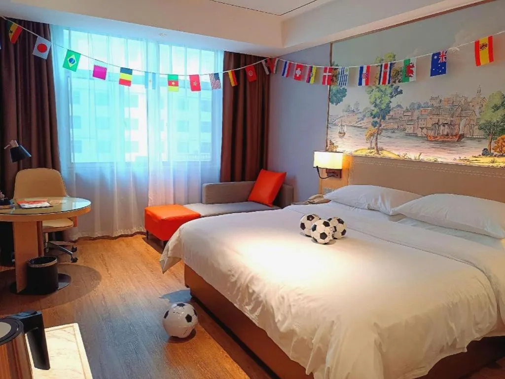 Bed in Vienna Hotel Guangxi Baise Xilin County Juting Cultural Arts Center