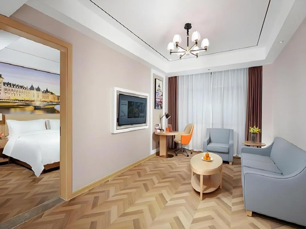 Bed in Vienna Hotel Guangxi Baise Xilin County Juting Cultural Arts Center