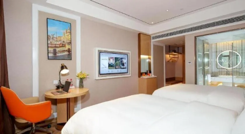 Bed in Vienna Hotel Guangxi Baise Xilin County Juting Cultural Arts Center