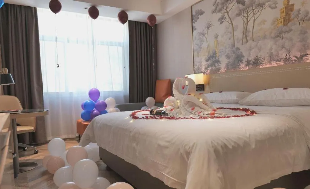 Bed in Vienna Hotel Guangxi Baise Xilin County Juting Cultural Arts Center