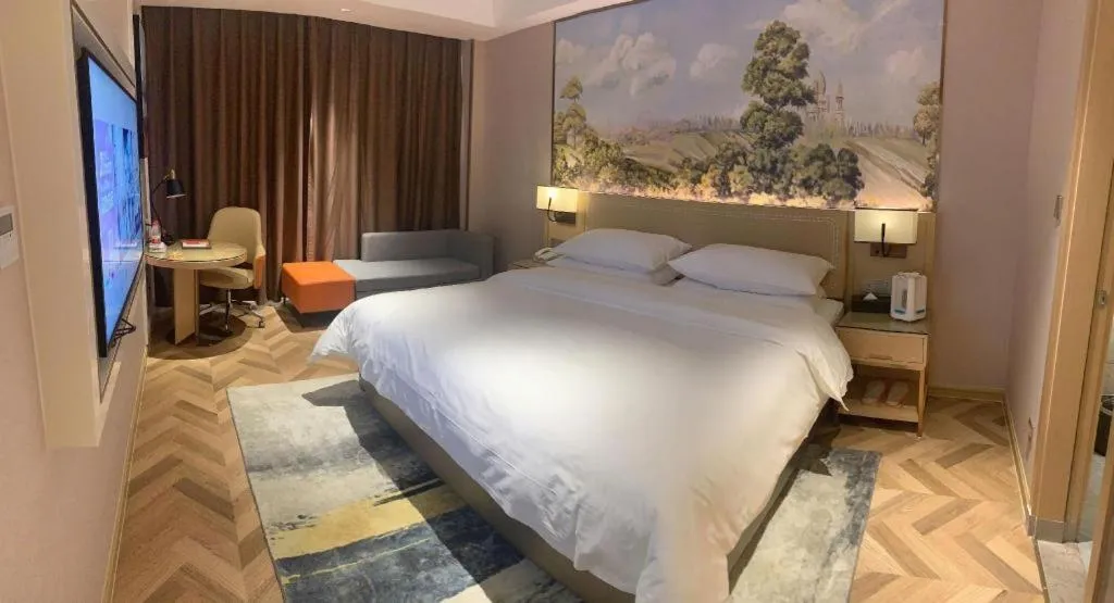 Bed in Vienna Hotel Guangxi Baise Xilin County Juting Cultural Arts Center