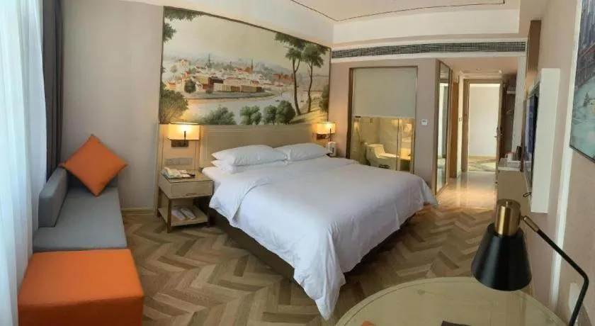 Bed in Vienna Hotel Guangxi Baise Xilin County Juting Cultural Arts Center