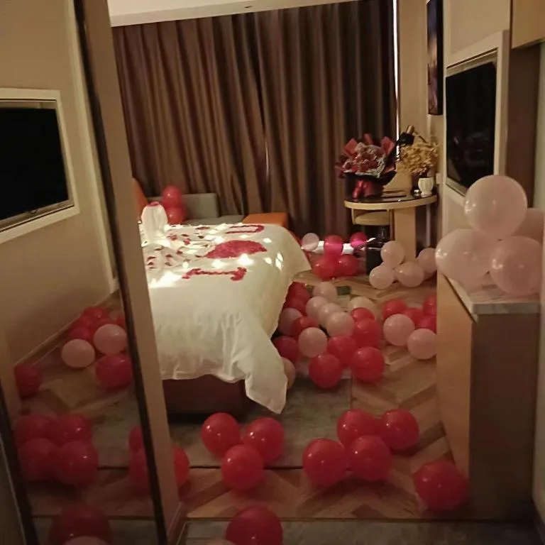 Bed in Vienna Hotel Guangxi Baise Xilin County Juting Cultural Arts Center