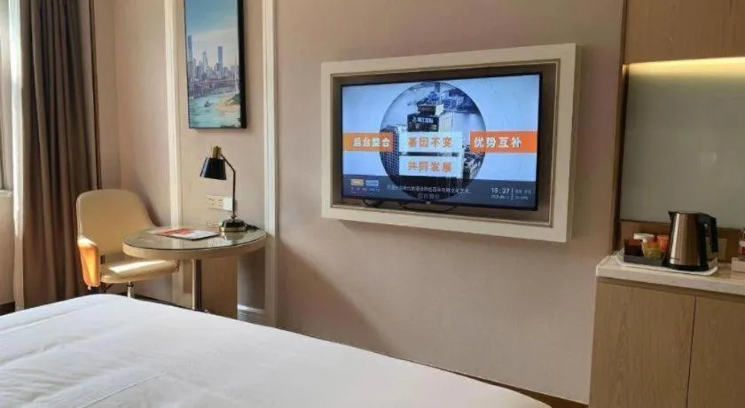 Bed in Vienna Hotel Guangxi Baise Xilin County Juting Cultural Arts Center