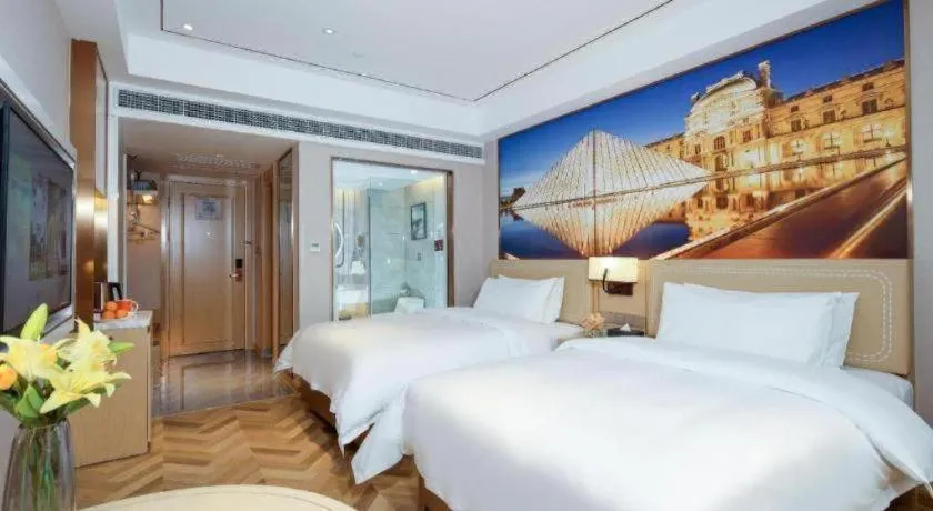 Bed in Vienna Hotel Guangxi Baise Xilin County Juting Cultural Arts Center