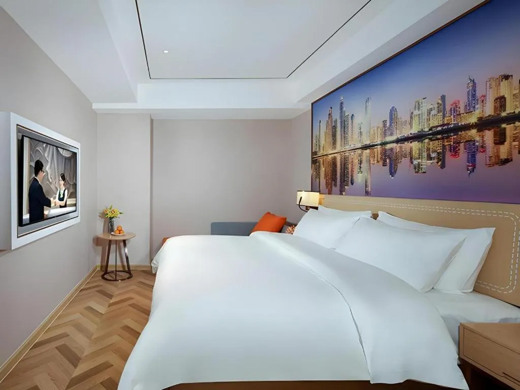 Bed in Vienna Hotel Guangxi Baise Xilin County Juting Cultural Arts Center