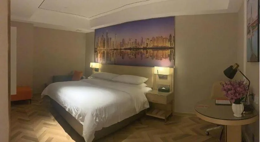 Bed in Vienna Hotel Guangxi Baise Xilin County Juting Cultural Arts Center