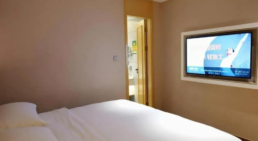 Bed in Vienna Hotel Guangxi Baise Xilin County Juting Cultural Arts Center