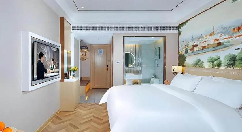 Bed in Vienna Hotel Guangxi Baise Xilin County Juting Cultural Arts Center