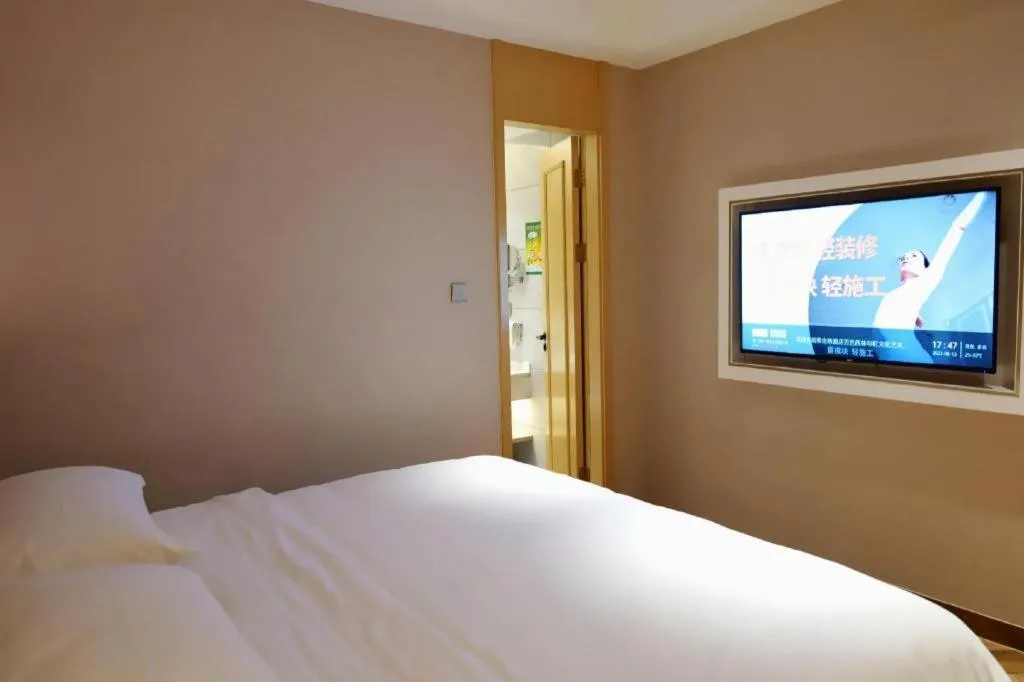 Bed in Vienna Hotel Guangxi Baise Xilin County Juting Cultural Arts Center