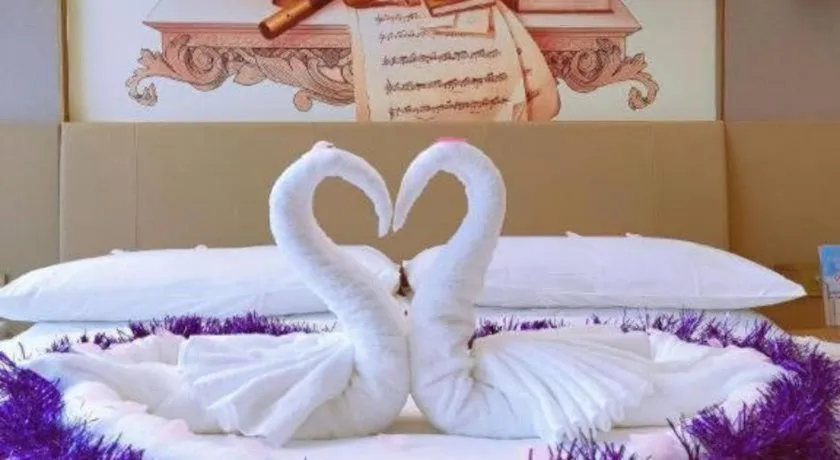 Bed in Vienna Hotel Guangxi Wuzhou High-Tech