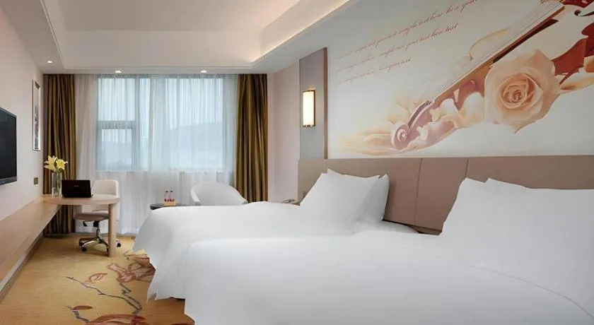 Bed in Vienna Hotel Guangxi Wuzhou High-Tech
