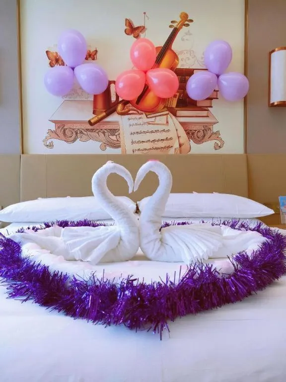 Bed in Vienna Hotel Guangxi Wuzhou High-Tech