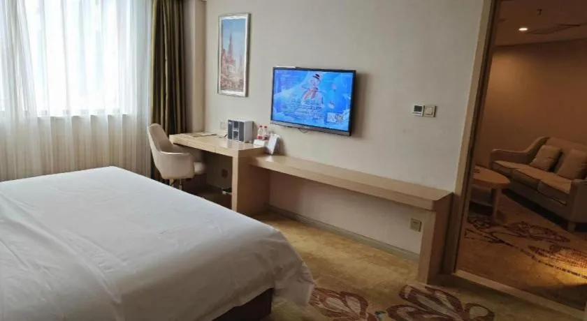 Bed in Vienna Hotel Guangxi Wuzhou High-Tech