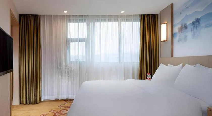 Bed in Vienna Hotel Guangxi Wuzhou High-Tech