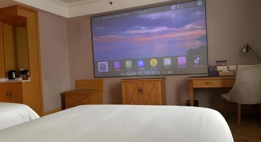 Bed in Vienna Hotel Guangdong Shaoguan Ruyuan Yao Cultural Square