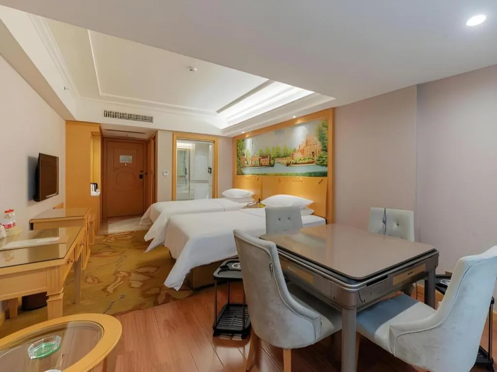 Bed in Vienna Hotel Guangdong Shaoguan Ruyuan Yao Cultural Square