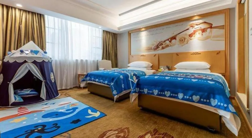 Bed in Vienna Hotel Guangdong Shaoguan Ruyuan Yao Cultural Square