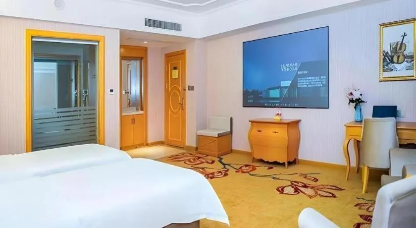 Bed in Vienna Hotel Guangdong Shaoguan Ruyuan Yao Cultural Square