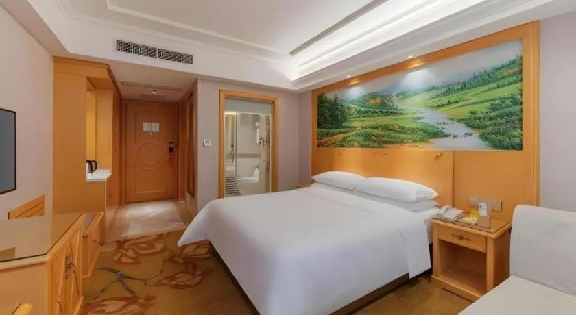 Bed in Vienna Hotel Guangdong Shaoguan Ruyuan Yao Cultural Square